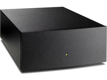 Involucro rettangolare nero opaco Naim Audio StageLine, vista dall'alto, con LED verde sulla parte frontale e connettori sul retro
