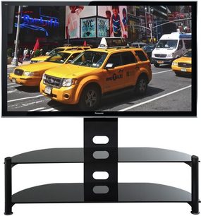 Sort TV-møbel med 3 glashylder. Gule taxier parkeret på en travl gade med reklameskilte i baggrunden