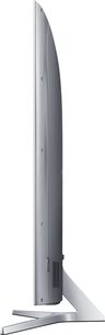 Samsung UE55JS9000 ultrafladskærms-TV, buet skærm, sølvfarvet ramme og fod, set fra siden på hvid baggrund
