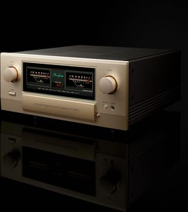 Integreret stereo hi-fi forstærker E-5000, trekvart visning, gylden front, 2 store cirkulære knapper, 2 centrale vu-metre