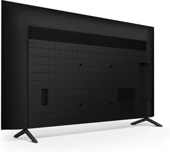 Sony BRAVIA 3 K50S3 tv i mat sort plast, set bagfra i trekvart vinkel, panel med gittermønster og ventilationsåbninger øverst og nederst, to V-formede metalfødder