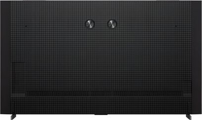 Televisor de alta definición TCL 98C8K negro, panel trasero cuadriculado de plástico con dos discos metálicos cepillados en el centro, vista trasera con patas laterales visibles