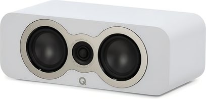 Q Acoustics 3090c white center speaker in a matte white enclosure, shown from the front right three-quarter view, featuring two black woofers with gray surrounds and a smaller central tweeter, Q logo centered at the bottom of the front panel, rounded corners