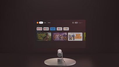 Videoproiettore XGIMI MoGo 3 Pro su supporto circolare, schermo proiettato con applicazioni di streaming visibili, vista frontale