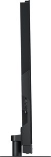 Televizor Panasonic TV-77Z93AEG s vysokým rozlišením, pohled z pravého boku, ultra tenký displej, viditelné konektory, černý válcový stojan