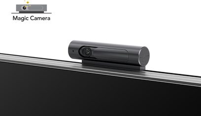 Sort cylindrisk kamera på metalskinner, set fra siden, med indbygget objektiv og mikrofon, kaldet "Magic Camera"