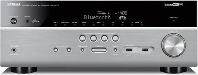 Yamaha RX-V681 titanium home theater amplifier, front view, silver facade with blue LCD screen, control buttons and knobs, USB port and headphone jack