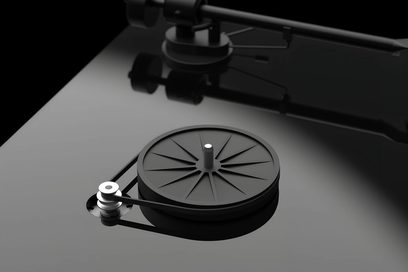 Pro-Ject T1 EVO BT hi-fi turntable with black circular platter, belt, silver pulley, and tonearm in the background