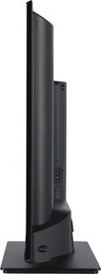 Panasonic TV-32S55AEZ højdefinitions-tv, sidevisning, fladskærm, sort ramme, rektangulær base, synlig stikforbindelse