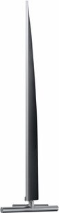 Samsung QE65Q6F (2017) TV sett fra siden, flat og tynn skjerm, rektangulær metallstativ, mørk gråfarge