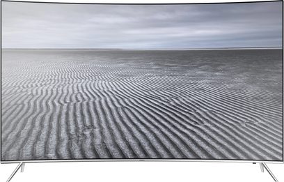 Samsung UE43KS7500 TV set forfra, buet skærm der viser et mønster af bølgede linjer på en strand, smal sølvfarvet ramme