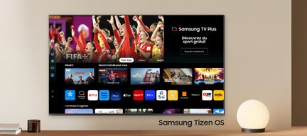 Skærmbillede af Samsung Tizen OS-grænsefladen, der viser miniaturer af sportsprogrammer og applikationsikoner
