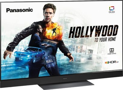 Panasonic TX-55GZ2000E OLED HDR+ TV-skærm, der viser en reklame med en mand foran en blå bil i byen