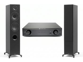 Impianto hi-fi con amplificatore NuPrime nero tra due diffusori da pavimento Elipson neri, uno dei quali con altoparlanti a vista