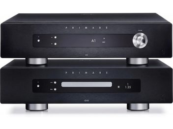 Black Primare I35 integrated amplifier placed on black Primare CD35 CD player, front view
