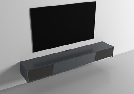 Black flat screen wall-mounted above an anthracite gray metallic-look cabinet with fabric side grilles, oblique view