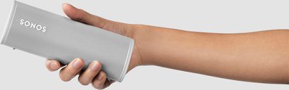 Sonos Roam Lunar White Bluetooth speaker held in a hand against a white background, front view