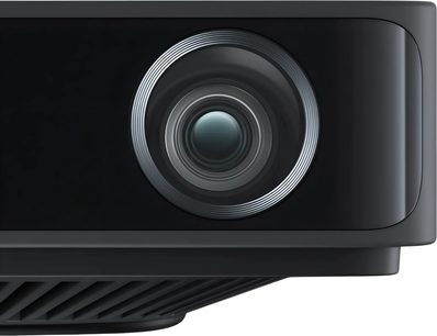 Projektor Loewe We. BEAM črn, bližnji pogled od spredaj na osrednji objektiv, obrobljen s srebrom