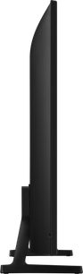Samsung TQ85Q7F4 2025 højopløsnings-tv, sort, slankt kabinet i metal og plast med lodrette riller på bagsiden, monteret på et centralt, vinklet stativ, sidevisning