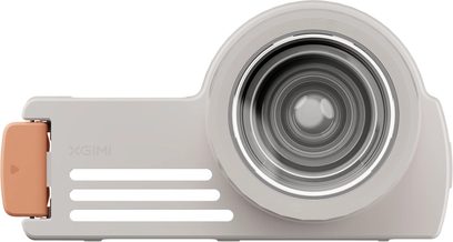 Replacement lens for XGIMI projector, front view, central circular lens, rectangular gray casing, orange attachment