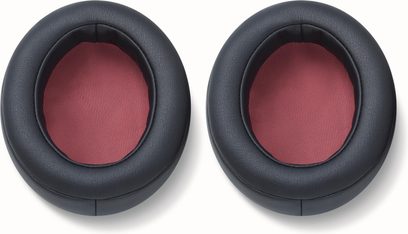 To ovale øreputer i svart kunstskinn med rød netting på innsiden, sett ovenfra, for Yamaha YH-C3000 hodetelefoner