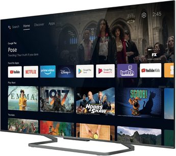 TCL 65C727 TV-skærm, der viser Google TV-grænsefladen med miniaturebilleder af film, tv-serier og streaming-apps