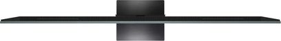 TCL 65C9K højopløsnings-tv i sort, ultratynd metalramme med kontinuerligt ventilationsgitter og centralt fod i børstet metal, set ovenfra