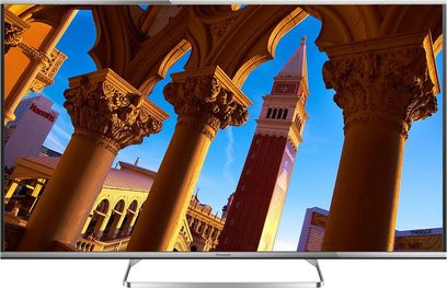 Telewizor Panasonic TX-47AS650E wyświetlający obraz rzeźbionych kolumn pod łukami, z błękitnym niebem w tle