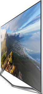 Samsung UE40H7000 fladskærms-TV, der viser et bjerglandskab med skyer og vegetation, set fra siden