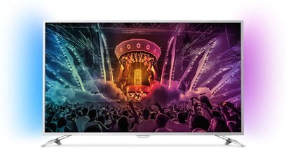 Philips 43PUS6501/12 fladskærms-TV, der viser en folkemængde ved en koncert med farverige fyrværkerier og lyseffekter