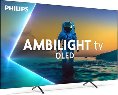 Τηλεόραση Philips 77OLED810 μαύρη, μεγάλη οθόνη OLED με πολύ λεπτό μεταλλικό πλαίσιο και γυάλινη επιφάνεια, τρισδιάστατη μπροστινή όψη, τοποθετημένη σε δύο κεκλιμένα μεταλλικά πόδια