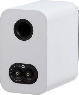 Q Acoustics 3010c white bookshelf speaker, matte-finish wooden cabinet, three-quarter rear view showing the black bass-reflex port and the black dual binding post plate with polarity markings