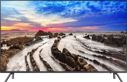 Samsung UE65MU7045 65" TV viser et snoet klippelandskab ved solnedgang med en farverig, skyllet himmel