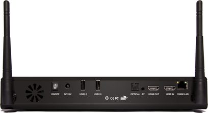 Rektangulær sort kabinet med USB-, HDMI-, netværks- og optiske stik på bagsiden, logo og tænd/sluk-knap på forsiden