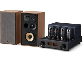 Pair of bookshelf speakers in wood finish with black tube amplifier, three-quarter front view