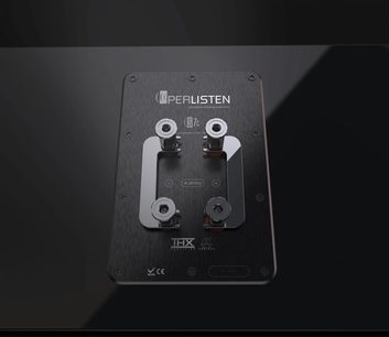 S7c center speaker with a rectangular black rear panel, 4 metallic connection terminals, visible technical inscriptions, and logos.