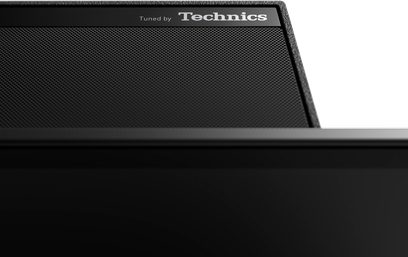 Panasonic TX-77LZ2000E-tv, slukket skærm, nærbillede af venstre øverste hjørne forfra, mat sort ramme "Tuned by Technics"