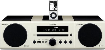 Yamaha MCR-040 white mini hi-fi system, front view, with CD player, LCD display, buttons, and integrated speakers