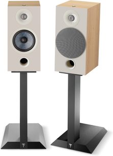 Two white Focal Chora 806 acoustic speakers on black stands, shown from the front, with visible speaker drivers