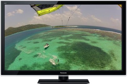 Panasonic TX-L39EM5-fladskærm, der viser et luftfoto af et turkisblåt hav med en kitesurfer og en båd, set forfra