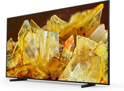 Sony XR98X90L fladskærms-tv, set forfra, gule krystaller vist, sort ramme, rektangulær stander