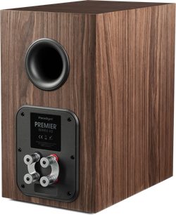 Diffusore da scaffale Paradigm Premier 120B v2 noce, vista posteriore a tre quarti con condotto circolare e doppi morsetti