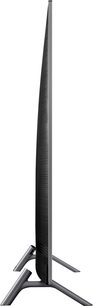 Samsung QE65Q6F 2018 fladskærms-TV, set fra siden, flad skærm, Y-formet fod, mørk grå metallisk ramme og fod