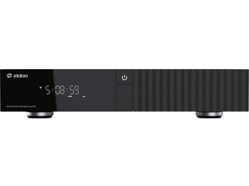 Multimedia-Player Z3000 Pro, Vorderansicht, rechteckiges schwarzes Gehäuse, digitales Display mit Uhranzeige, runder Netzschalter, zylindrische Füße