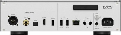 Transport numérique Matrix Audio TT-1 argenté en aluminium brossé, vue arrière de face, panneau de connectique intégrant sortie XLR AES/EBU, prise coaxiale RCA, sortie optique, port HDMI I2S, deux ports USB‑A, port LAN RJ45, borne trigger, vis de masse, entrée secteur IEC, pieds cylindriques noirs