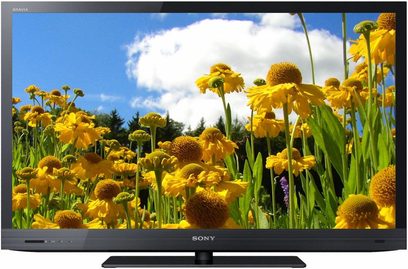 Sony KDL-37EX720 TV-skærm, der viser et felt med gule blomster mod en blå himmel med nogle hvide skyer