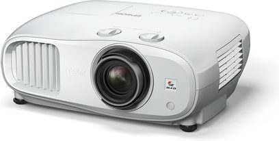 Epson EH-TW7000 white video projector, slightly angled front view, centered lens, side ventilation grilles