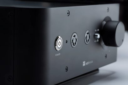 High-fidelity headphone preamplifier Hifiman Jade II Amplifier, black casing, silver circular power button, 2 connectors, black rotary knob