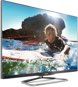 Philips 42PFL6907H fladskærms-TV, smal sort ramme, på metalfod, viser en surfer på en brydende bølge