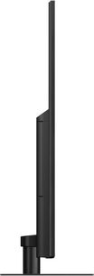 Panasonic TX-75HX940E-fladskærms-tv, set fra siden, flad skærm, smal sort ramme, rektangulært sort fod